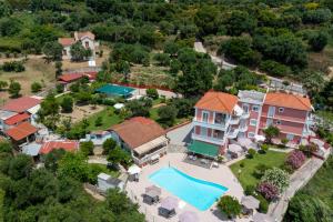 an aerial view of a house with a swimming pool at Amazona Apartments and Studios in Spartià