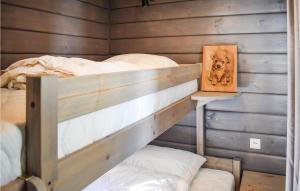 a bedroom with a bunk bed with a picture of a dog at 3 Bedroom Lake Front Home In Sperrebotn in Sperrebotn