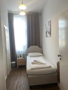 Postel nebo postele na pokoji v ubytování Hotel Lübecker Hof