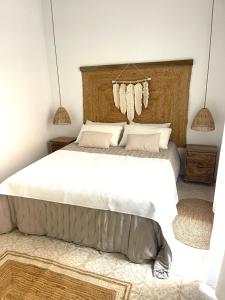 En eller flere senge i et værelse på El Patio Secreto