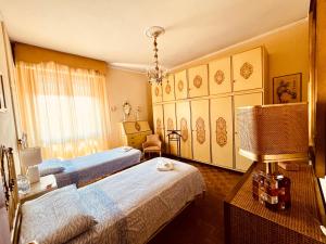 A bed or beds in a room at Affittacamere Umberto&Marisa