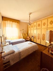 A bed or beds in a room at Affittacamere Umberto&Marisa