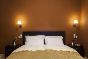 Postel nebo postele na pokoji v ubytování Hotel Meteoritis