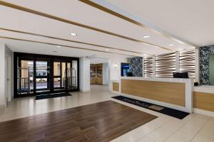 a lobby with a reception desk in a building at Sonesta ES Suites Orlando International Drive in Orlando