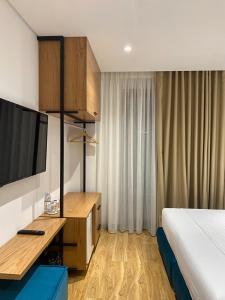 Postel nebo postele na pokoji v ubytování NOI HOTEL
