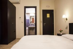 Postel nebo postele na pokoji v ubytování Hotel Meteoritis