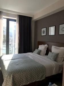 Voodi või voodid majutusasutuse AuRoom Bakuriani Resort toas