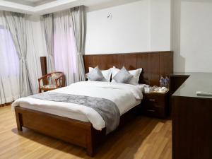 Letto o letti in una camera di YULOKO GUEST HOUSE