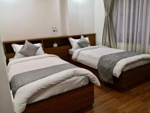 Letto o letti in una camera di YULOKO GUEST HOUSE