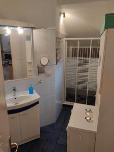 a small bathroom with a sink and a mirror at Dream House in Agria +31 photos