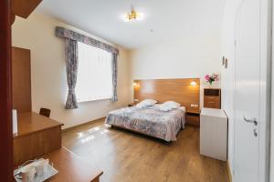 Postel nebo postele na pokoji v ubytování Villa Bachmann - Kuršių kiemas