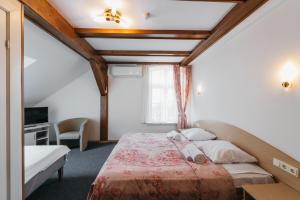 Postel nebo postele na pokoji v ubytování Villa Bachmann - Kuršių kiemas