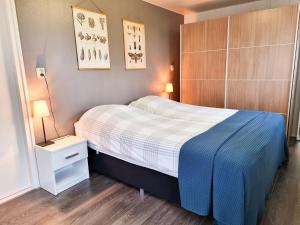 Ένα ή περισσότερα κρεβάτια σε δωμάτιο στο Vakantiewoning de Weide Blik SE12