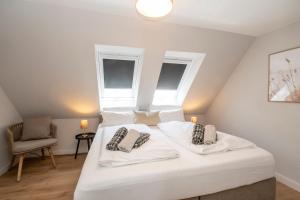 Ένα ή περισσότερα κρεβάτια σε δωμάτιο στο Ferienhaus Seeschwalbe 12 2