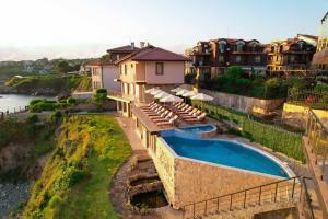 an aerial view of a house with a swimming pool at DOLPHIN BAY BOUTIQUE COMPLEX Sozopol in Sozopol
