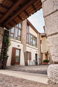 an outside view of a building with a patio at Ad Sidera in Pastrengo