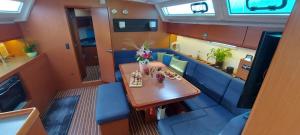 an overhead view of a table and chairs in a train car at Sailing Yacht Queen Eliza in Varna City