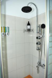 a shower with a shower head in a bathroom at Casa Eleni in Kanálion