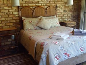 En eller flere senge i et værelse på Thirsty Falls CC