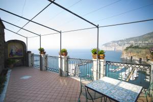 a balcony with a view of the ocean at Domus San Vincenzo in Sant'Agnello