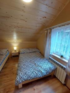 Letto o letti in una camera di Domek pod soszowem
