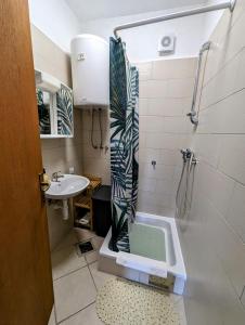 a bathroom with a shower and a sink at Marija Apartments in Kruševo