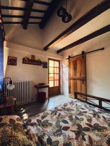 a bedroom with a large bed and a window at Casal Camillo in Case Selva Grande