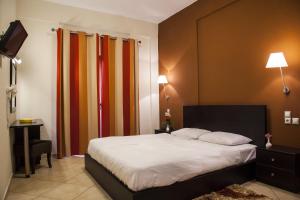 Postel nebo postele na pokoji v ubytování Hotel Meteoritis