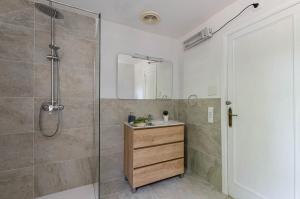 a bathroom with a shower and a sink and a mirror at YourHouse Can Marquesi in Lluc +28 photos