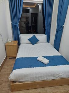 Postel nebo postele na pokoji v ubytování The Light Hotel