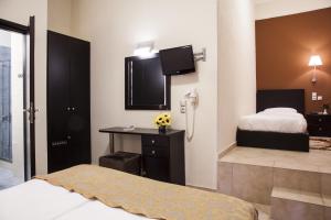 Postel nebo postele na pokoji v ubytování Hotel Meteoritis