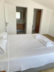 Postel nebo postele na pokoji v ubytování Anfora Villaları