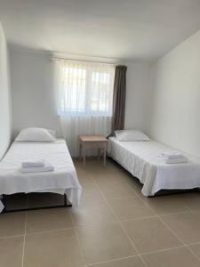 Postel nebo postele na pokoji v ubytování Anfora Villaları