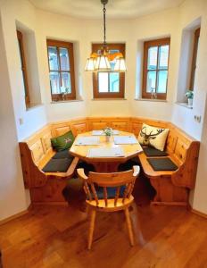 a dining room with a wooden table and chairs at Holiday apartment Sybille in Bad Kohlgrub in Bad Kohlgrub