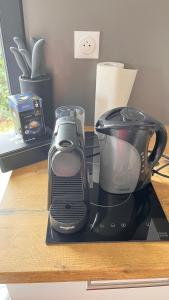 a coffee maker sitting on top of a counter at EcoKub T3 Indépendant Proche plages et lac in Soustons