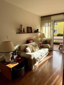 a living room with a couch and a table at Casa Horvais San Candido in San Candido