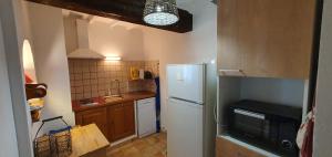 Kuchyň nebo kuchyňský kout v ubytování Appartement 3P Lubéron