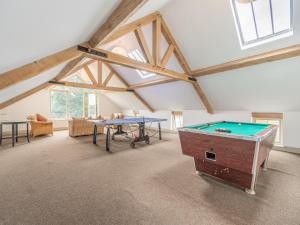 a room with a pool table in a attic at The Old Brewery in Pembroke