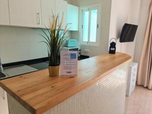 a kitchen counter with a box on top of it at Tabbu ibiza apartments in Playa d'en Bossa