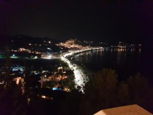 a night view of a bridge over the water at Pension los Verdiales in La Herradura