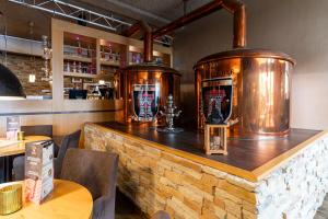 a bar with twobeer tanks on top of it at Dormio Resort Eifeler Tor in Heimbach