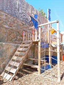 a wooden staircase in front of a building at House with pool near Park Guell in Barcelona