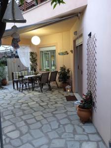 a patio with chairs and a table on a patio at Dream House in Agria