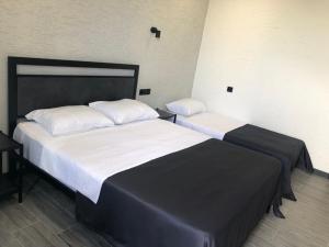 Postel nebo postele na pokoji v ubytování Hotel West Way