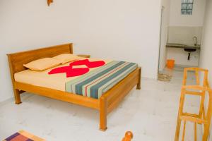 Postel nebo postele na pokoji v ubytování Navodya Guest Mirissa