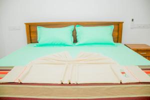 Postel nebo postele na pokoji v ubytování Navodya Guest Mirissa