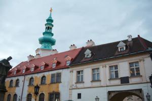 a building with a tower on top of it at Old town 1 bdr, A/C, w/parking in Bratislava