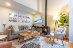 a living room with a couch and a fireplace at Telluride Mainstreet 2 Bedroom Condo in Telluride