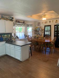 a kitchen and dining room with a table and chairs at Live Oak Home in Salado