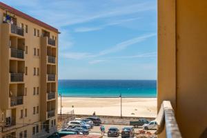 a view of the beach from a hotel balcony at Casa Los Lances Deluxe - Reformado Junto a la Playa y Terraza in Tarifa